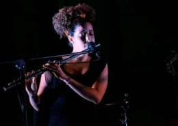 Rosi playing flute in Cuba