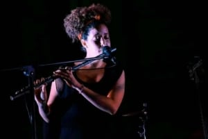 Rosi playing flute in Cuba